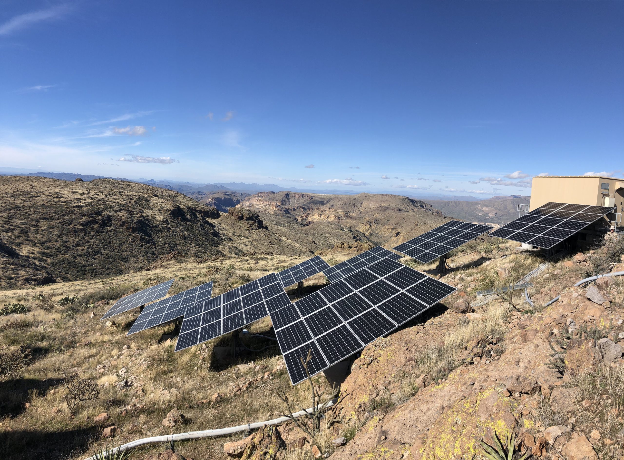 Solar arrays descending the slope to the communications tower at the Bronco Butte repeater site