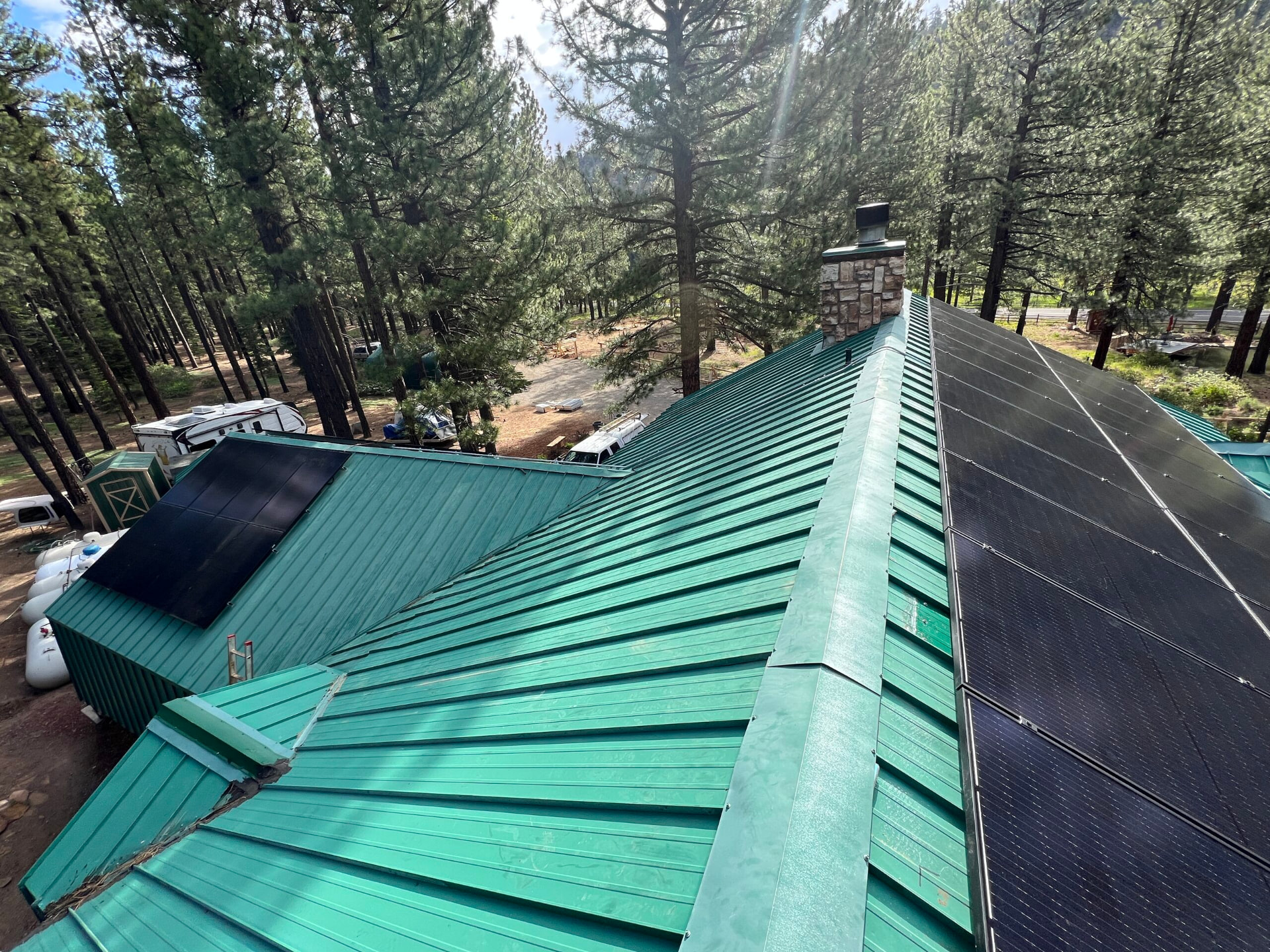 Roof-mounted solar on the log home in the Sierra forest